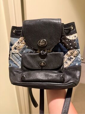 coach denim patchwork backpack Blue Shoulder Bag Rediscover Vintage Denim and smooth leather Inside zip and multifunction pockets Zip closure fabric lining Top handle with 2 drop Outside zip pocket Adjustable shoulder straps 7 1/2 (L) x 9 1/4 (H) x 3 3/4 (W) Style No. COACH Vintage DENIM Patchwork Ergo